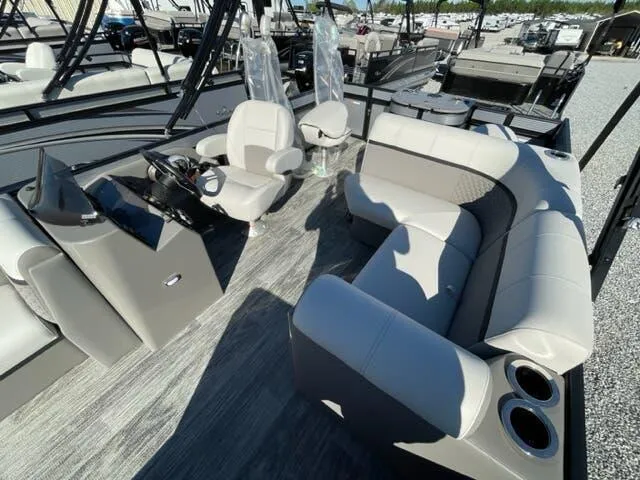 Slide: The Image of 2023 Qwest Pontoons E-Class XRE Cruise 822 LT interior with seating and helm. - 7