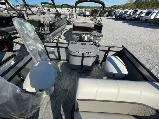 Slide: The Image of 2023 Qwest Pontoons E-Class XRE Cruise 822 LT interior with seating and storage. - 8