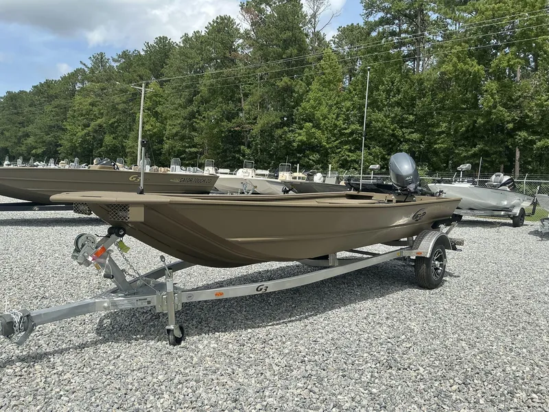 Slide: The Image of 2025 G3 Gator Tough 15 DK boat on trailer, parked outdoors. - 10