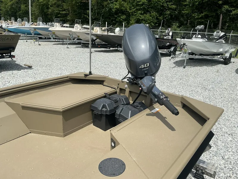 Slide: The Image of 2025 G3 Gator Tough 15 DK boat with Yamaha 40 engine in a gravel lot. - 14
