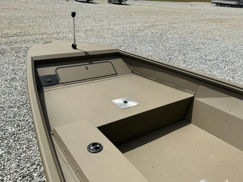 Slide: The Image of 2025 G3 Gator Tough 15 DK boat on gravel lot, showcasing interior details. - 15