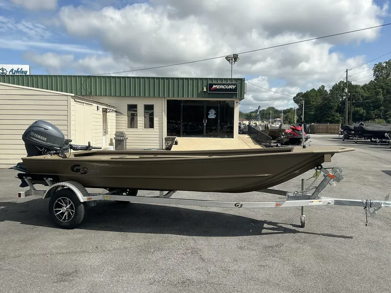 Slide: The Image of 2025 G3 Gator Tough 15 DK boat on trailer, parked outside dealership. - 3