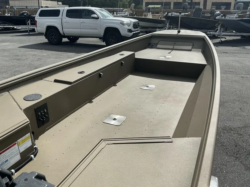 Slide: The Image of 2025 G3 Gator Tough 15 DK boat, spacious interior, parked outdoors. - 5