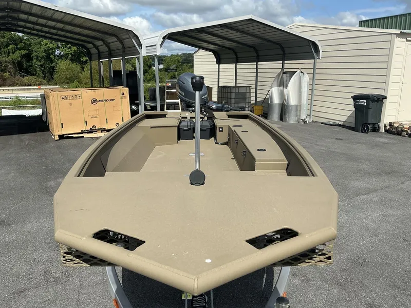 Slide: The Image of 2025 G3 Gator Tough 15 DK boat in outdoor storage area. - 8