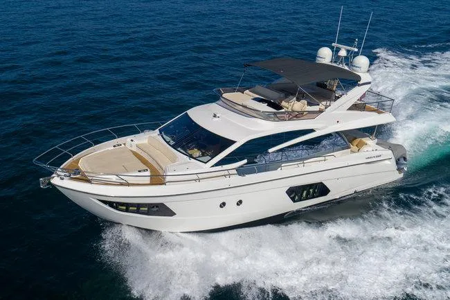 Slide: The Image of Luxurious 2015 Absolute Fly yacht cruising on open sea, showcasing sleek design and elegance. - 1