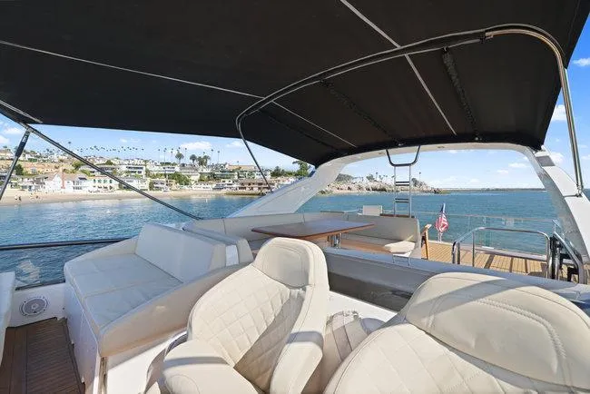 Slide: The Image of Luxurious 2015 Absolute Fly yacht with spacious deck, ocean view, and comfortable seating. - 10