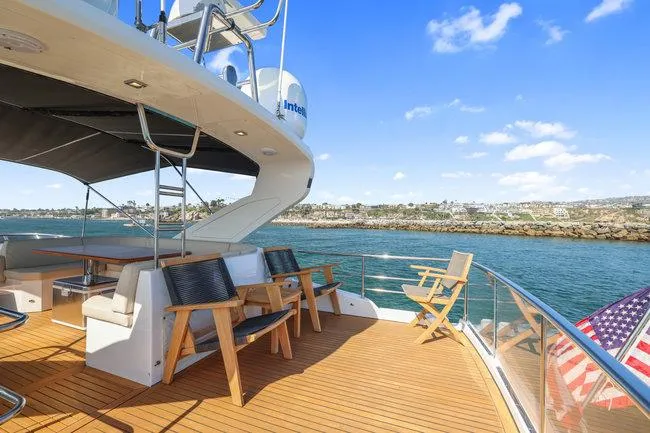 Slide: The Image of Luxurious 2015 Absolute Fly yacht deck with seating, overlooking serene waters and coastline. - 13
