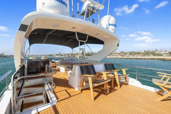 Slide: The Image of Luxurious 2015 Absolute Fly yacht deck with seating, offering fractional ownership. - 14