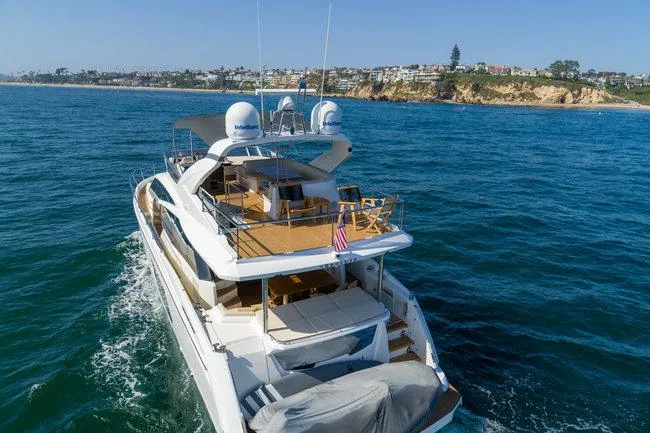 Slide: The Image of Luxurious 2015 Absolute Fly yacht cruising near scenic coastline. - 2