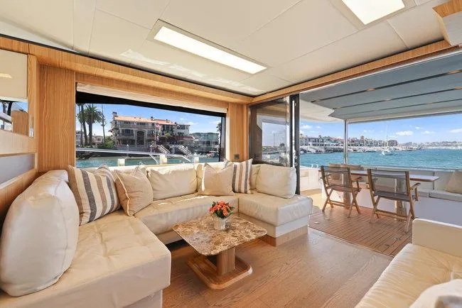 Slide: The Image of Luxurious yacht interior with elegant seating, marble table, and ocean view, 2015 Absolute Fly model. - 23