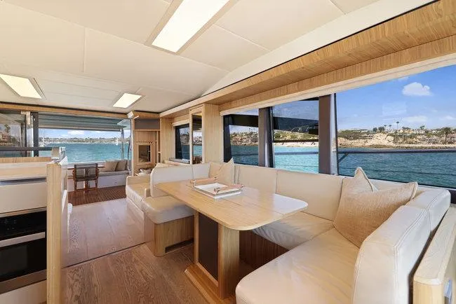 Slide: The Image of Luxurious yacht interior with dining area, panoramic windows, and ocean view. Absolute Fly 2015 model. - 26