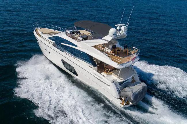 Slide: The Image of Luxury Absolute Fly yacht cruising on open sea, 2015 model, showcasing sleek design and elegance. - 3
