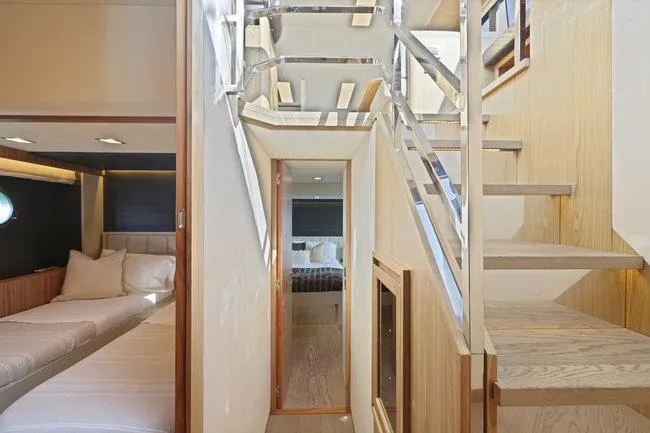 Slide: The Image of Interior of 2015 Absolute Fly yacht, featuring modern design and wooden staircase. - 30
