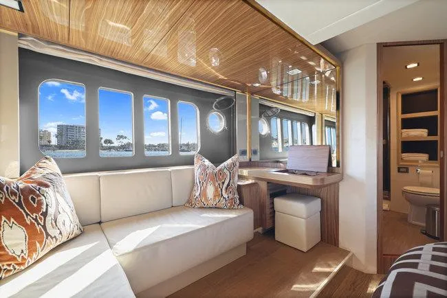 Slide: The Image of Luxurious yacht interior with elegant seating, wooden accents, and scenic ocean views through large windows. - 43