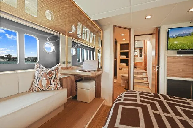 Slide: The Image of Luxurious yacht interior with modern design, featuring a cozy seating area and elegant decor. - 44