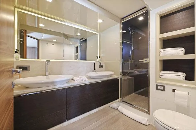 Slide: The Image of Luxurious yacht bathroom with dual sinks, glass shower, and modern design. Absolute Fly 2015 model. - 45