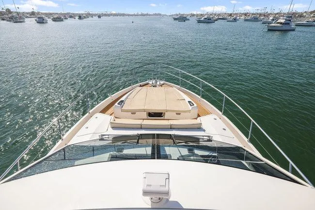 Slide: The Image of Bow view of 2015 Absolute Fly yacht on calm waters, showcasing luxury fractional ownership. - 5