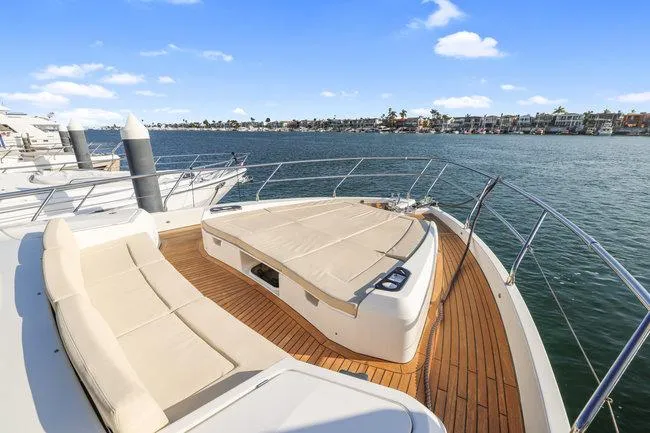 Slide: The Image of Luxury yacht deck with seating, Absolute Fly 2015, overlooking serene waterfront. - 6