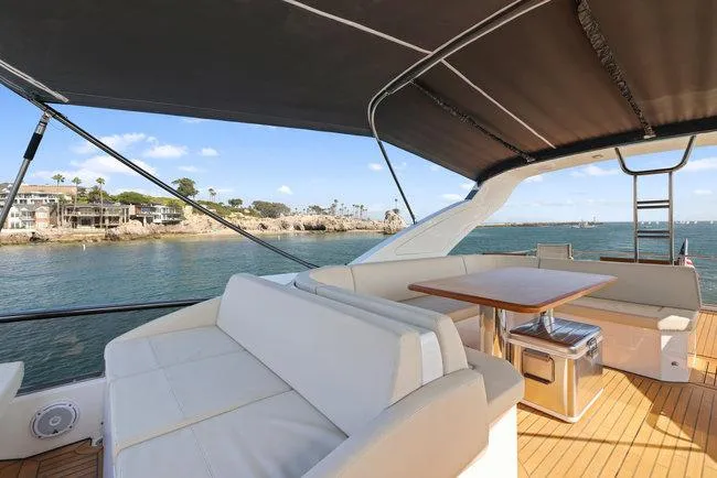 Slide: The Image of Luxurious 2015 Absolute Fly yacht with spacious deck and seating, offering stunning ocean views. - 9