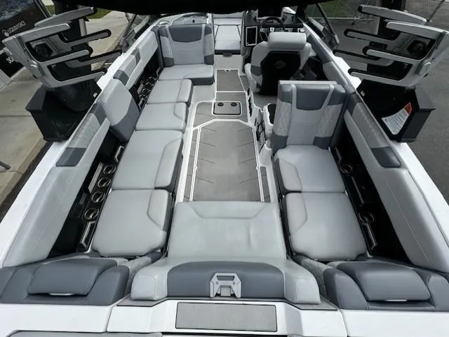Slide: The Image of 2021 Malibu M240 boat interior with spacious seating and modern design. - 11