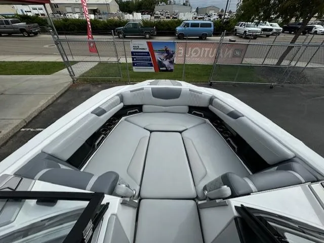 Slide: The Image of 2021 Malibu M240 boat interior with spacious seating and modern design. - 13