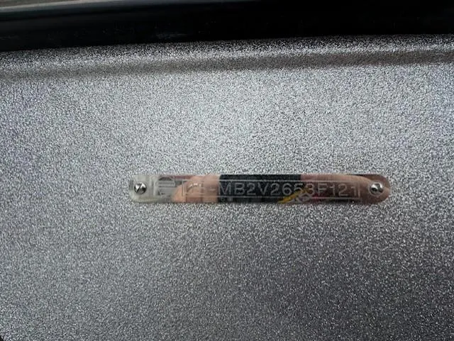 Slide: The Image of 2021 Malibu M240 identification plate on metallic surface. - 22