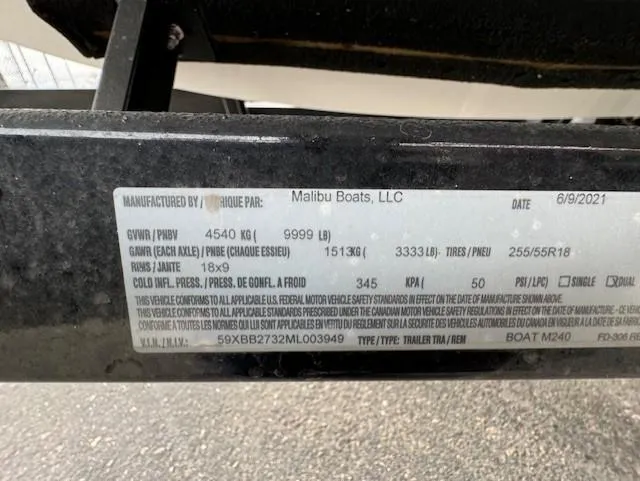 Slide: The Image of Label on 2021 Malibu M240 boat trailer detailing specifications and compliance information. - 23