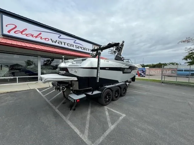 Slide: The Image of 2021 Malibu M240 boat on trailer at Idaho Water Sports dealership. - 3