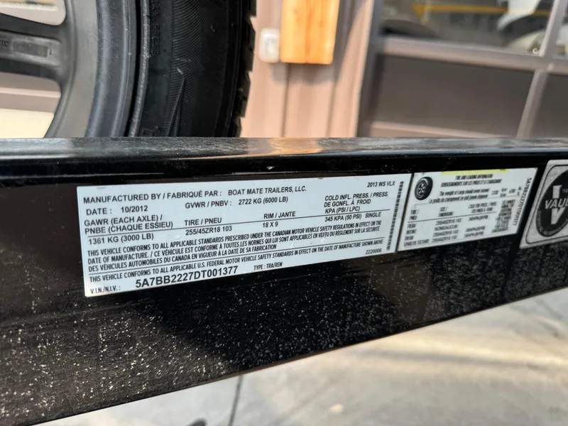 Slide: The Image of Label on a 2013 Malibu WVLX trailer, detailing specifications and manufacturing information. - 14