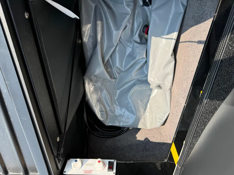 Slide: The Image of Interior compartment of a 2013 Malibu WVLX with storage and control panel. - 9