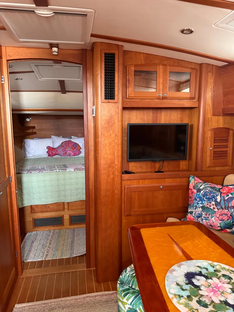 Slide: The Image of Interior of 2005 Sabre 38 yacht with cozy cabin and floral decor. - 10