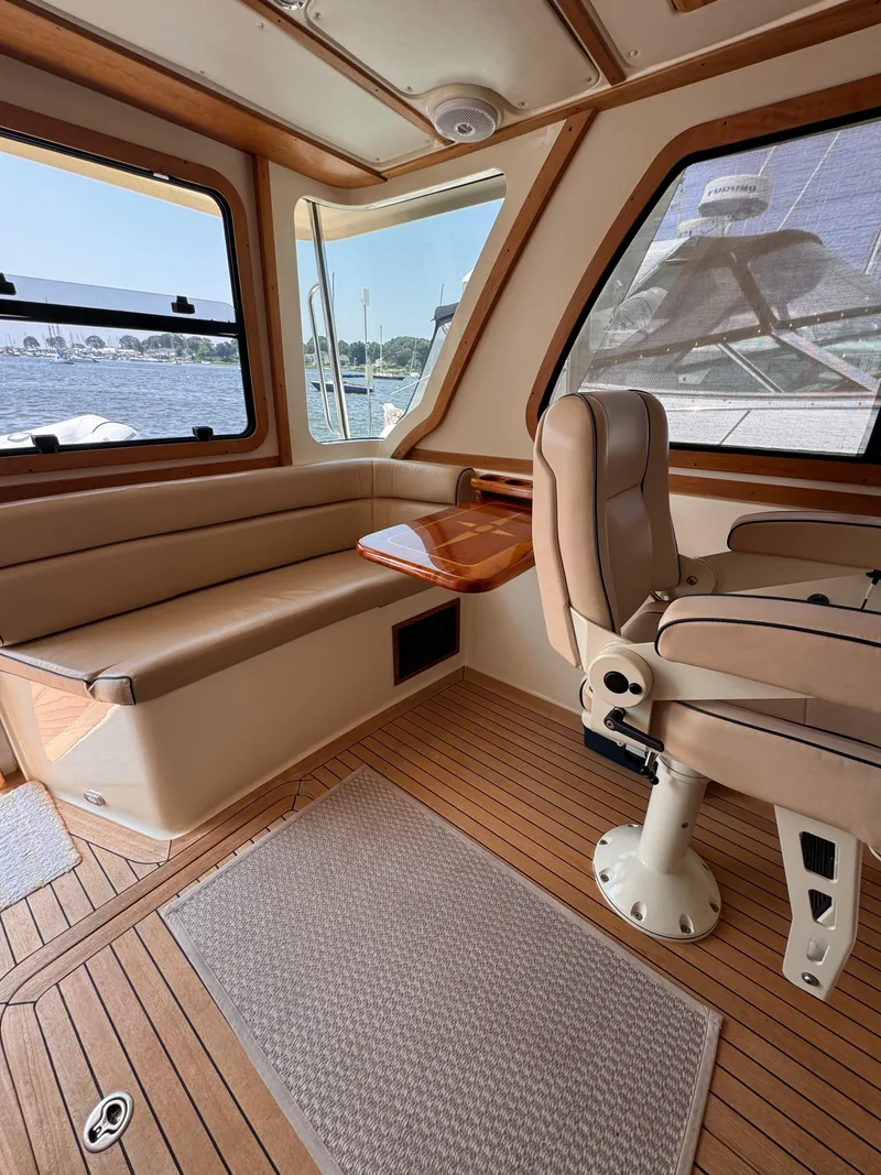 Slide: The Image of Interior of 2005 Sabre 38 yacht with leather seating and wooden flooring. - 17