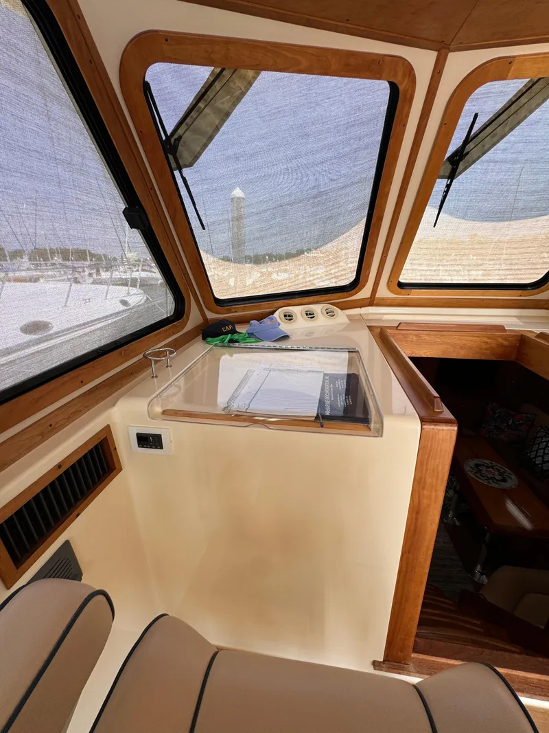 Slide: The Image of Interior of 2005 Sabre 38 boat with wooden trim and large windows. - 19