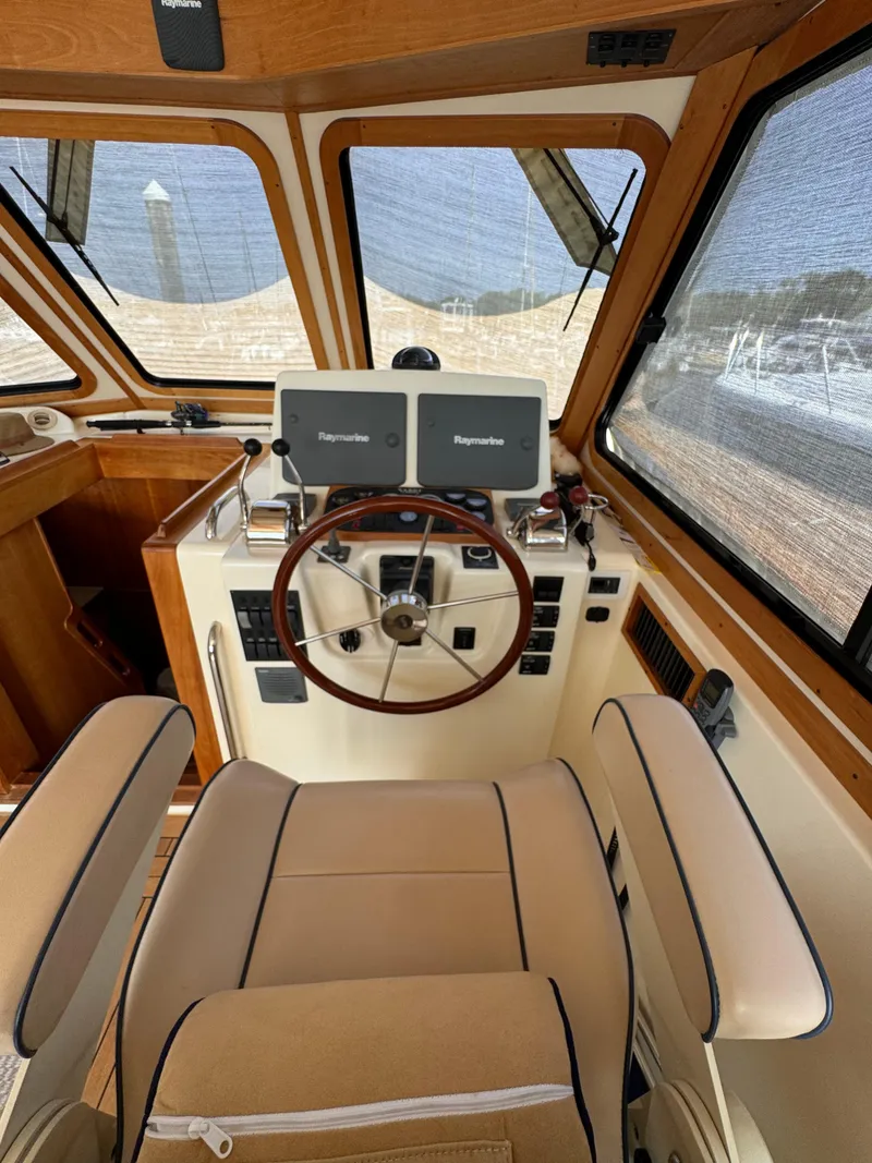 Slide: The Image of Interior of 2005 Sabre 38 boat with helm and navigation equipment. - 21