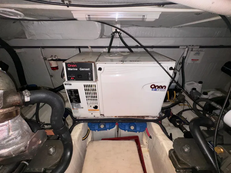 Slide: The Image of Onan marine generator in a 2005 Sabre 38 engine room. - 27
