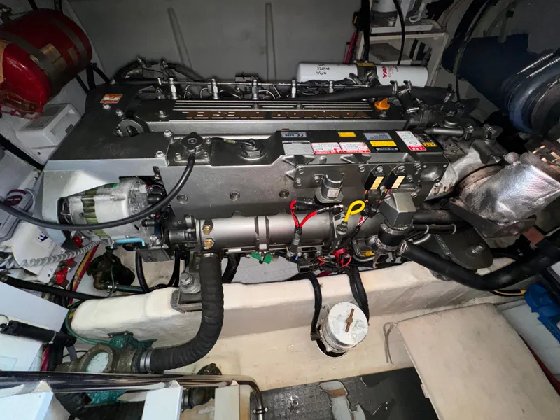 Slide: The Image of Engine compartment of a 2005 Sabre 38 boat, showcasing detailed mechanical components. - 29