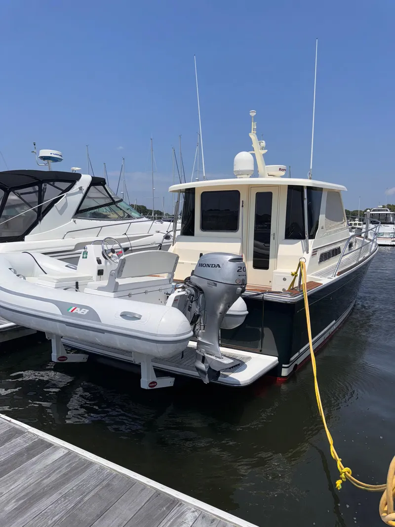 Slide: The Image of 2005 Sabre 38 yacht docked with inflatable boat attached. - 3
