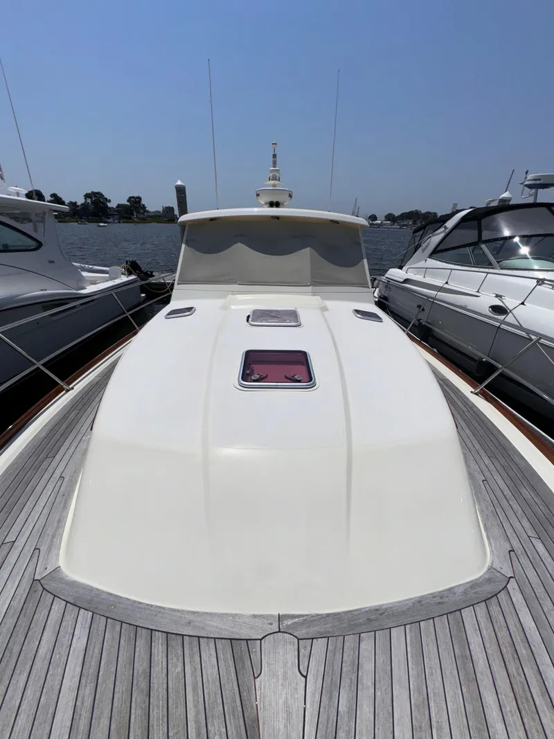 Slide: The Image of 2005 Sabre 38 yacht docked between two boats on a sunny day. - 33