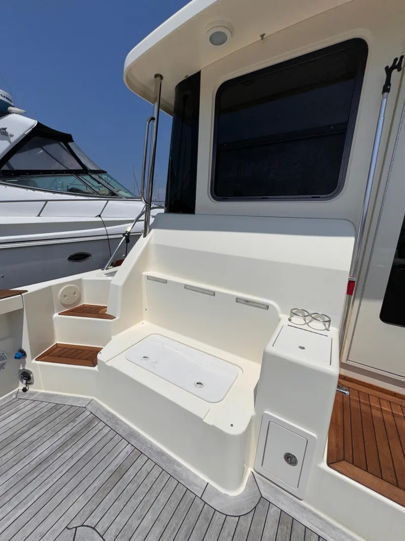 Slide: The Image of 2005 Sabre 38 yacht deck with seating and storage. - 35
