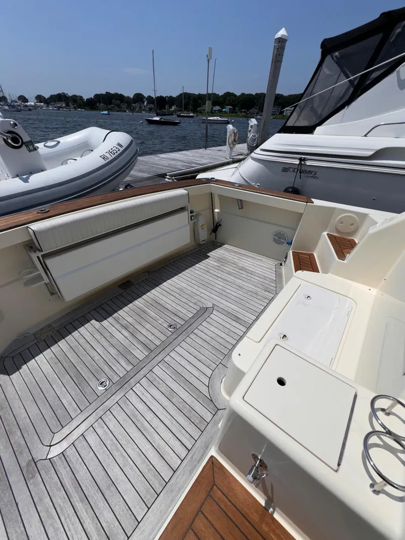 Slide: The Image of 2005 Sabre 38 boat deck with wood finish, docked at marina. - 37