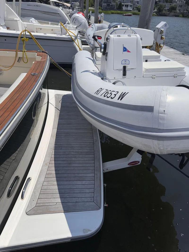 Slide: The Image of 2005 Sabre 38 yacht docked with inflatable boat alongside. - 39