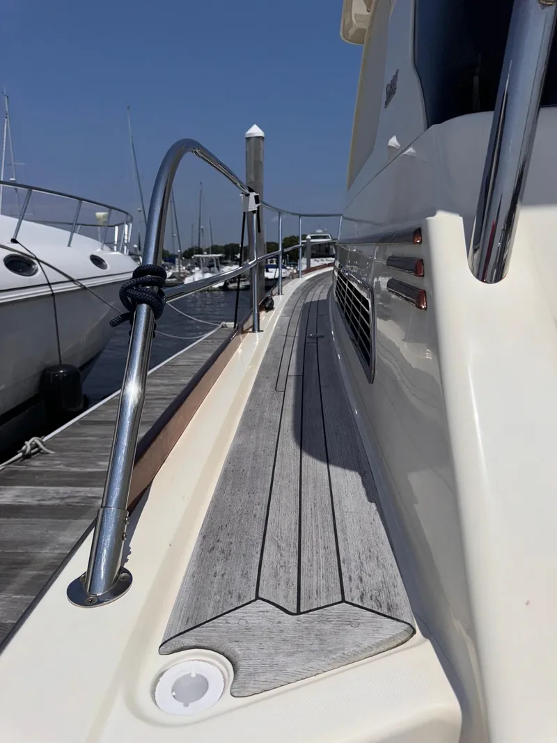 Slide: The Image of 2005 Sabre 38 yacht deck with sleek design and polished railings. - 40