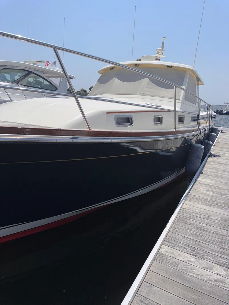 Slide: The Image of 2005 Sabre 38 yacht docked at marina on a sunny day. - 41