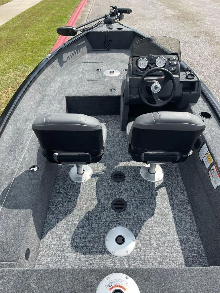 Slide: The Image of 2025 Tracker Super Guide V-16 SC fishing boat interior with dual seats and steering console. - 4