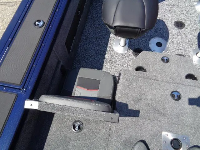 Slide: The Image of 2025 Tracker Targa V-18 Combo boat interior with seating and carpeted flooring. - 10