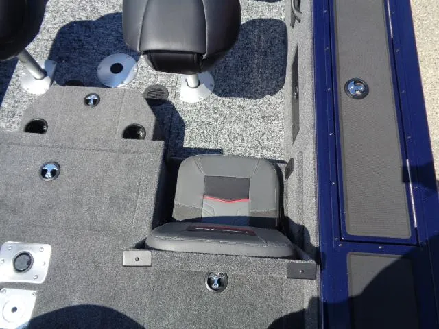 Slide: The Image of 2025 Tracker Targa V-18 Combo boat interior with seating and carpeted flooring. - 11