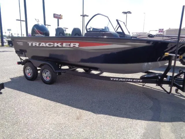Slide: The Image of 2025 Tracker Targa V-18 Combo boat on trailer in parking lot. - 4