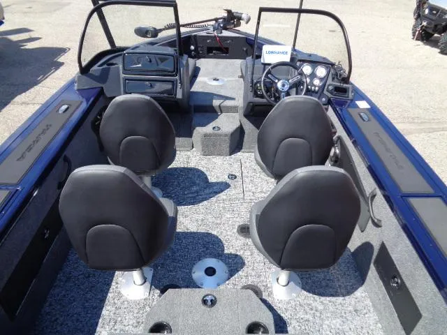 Slide: The Image of 2025 Tracker Targa V-18 Combo boat interior with four seats and modern dashboard. - 5