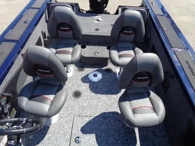 Slide: The Image of 2025 Tracker Targa V-18 Combo boat interior with four gray seats. - 6
