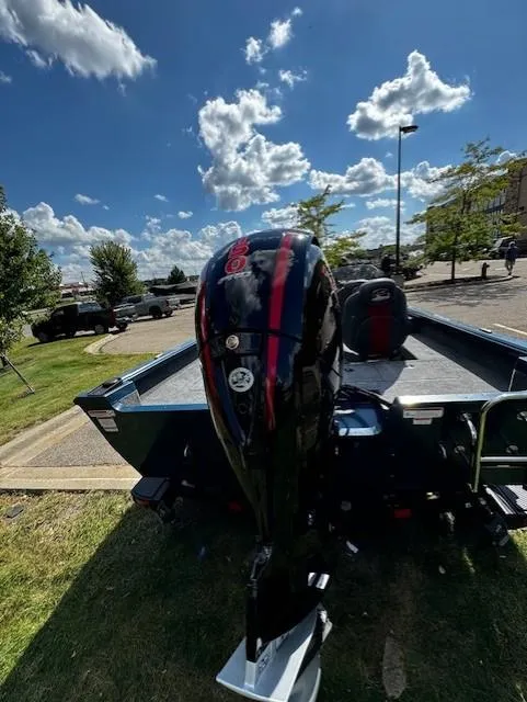 Slide: The Image of 2024 Ranger VS1782SC Angler boat with powerful outboard motor in a sunny parking lot. - 5